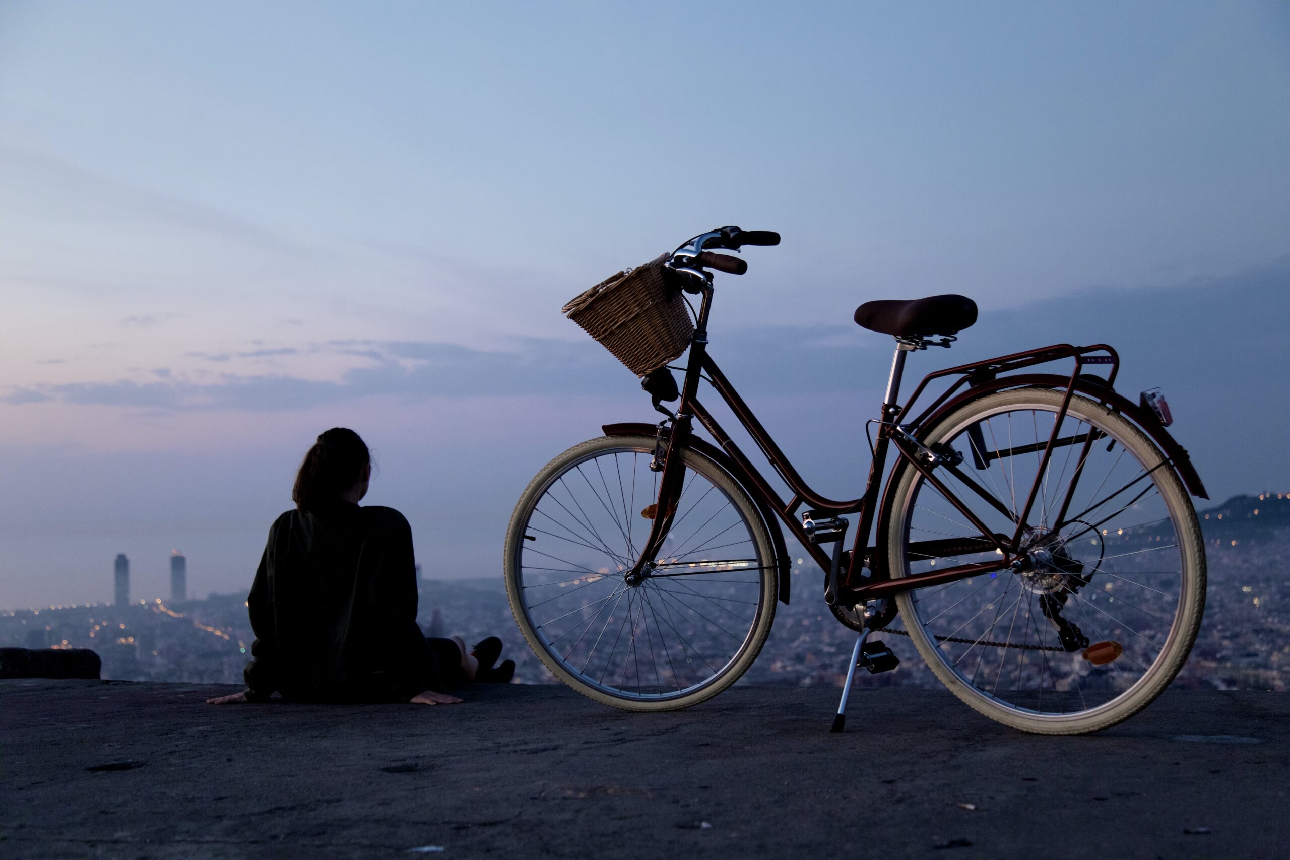 February evening girl fixing bike